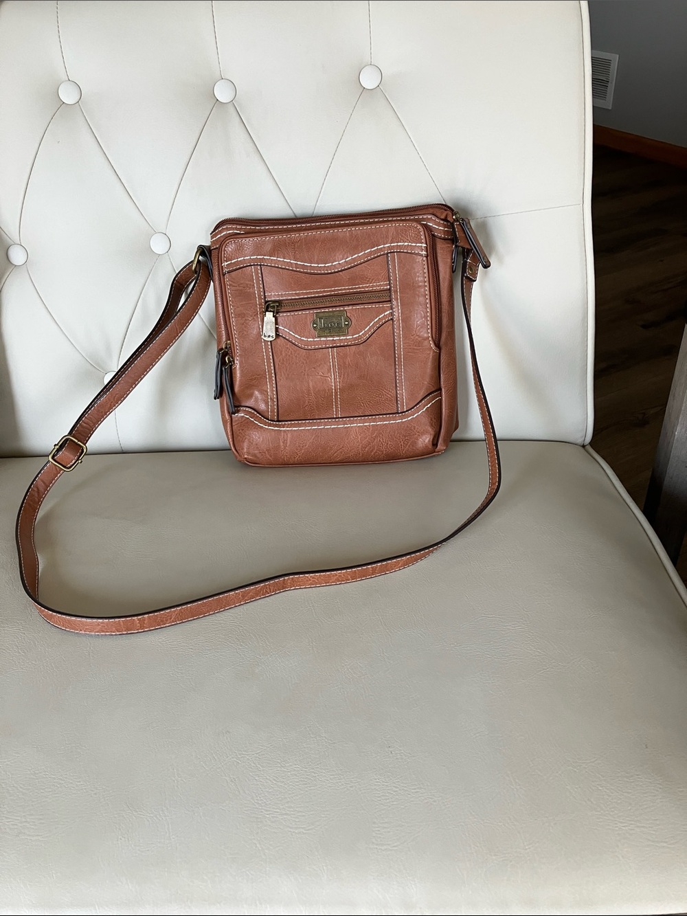 boc cognac leather crossbody with front zip pocket